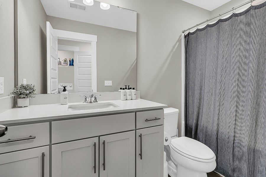 Bathroom #2 is shared by the other two bedrooms and includes a tub/shower combo and a spacious double vanity.