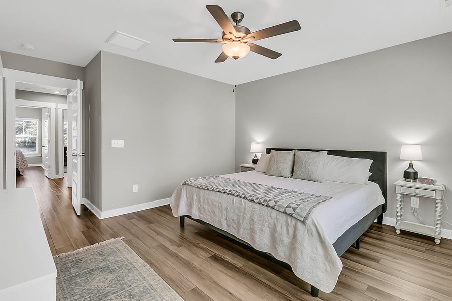 Bedroom #1, the primary suite, includes a king-sized bed, large closet, smart TV, and an en-suite bath with a spacious walk-in shower.