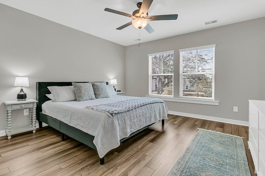 Bedroom #1, the primary suite, includes a king-sized bed, large closet, smart TV, and an en-suite bath with a spacious walk-in shower.