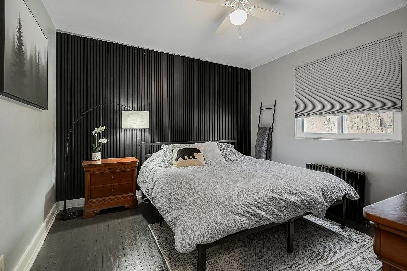 Large bedroom hosts king bed and ample closet space
