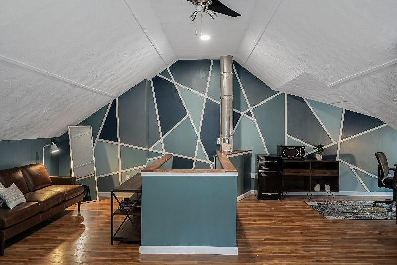 Upstairs loft is open floor plan with kitchenette, lounge, office and sleeping spaces