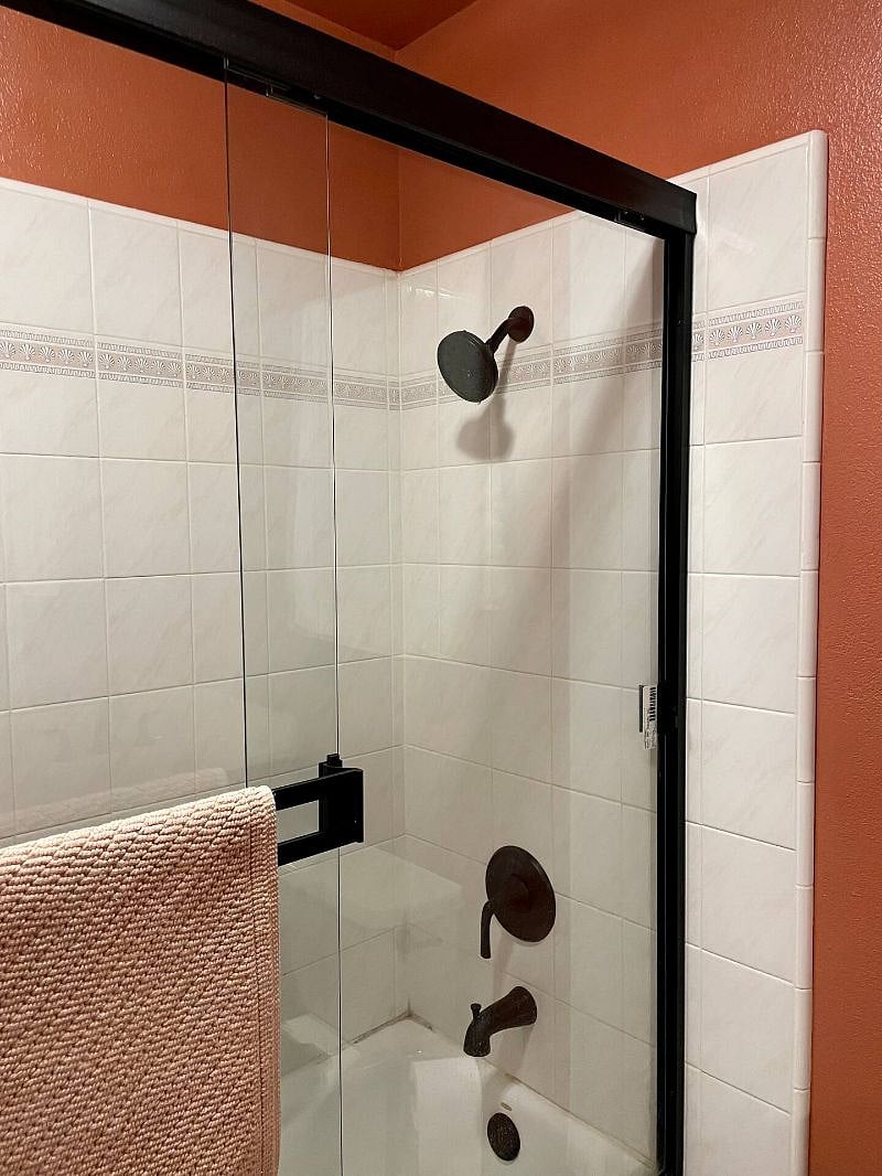 Standard-sized tub and wall shower.