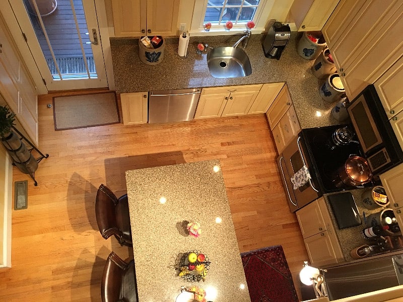 Looking down from upper bedroom into kitchen
