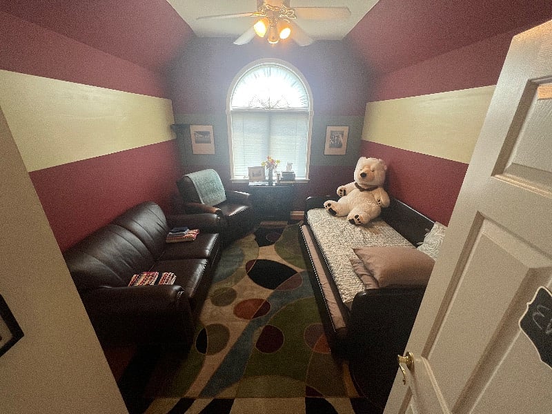 One of two guest rooms depending on your tastes and style. Twin bed with sofa and recliner in room.
