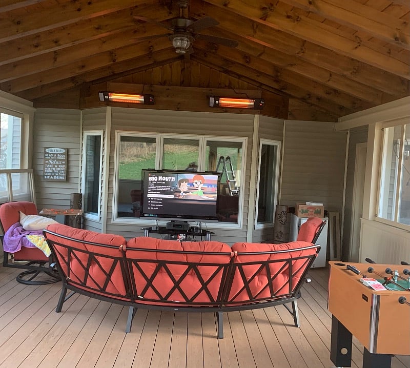 Screened in porch with hot tub and TV