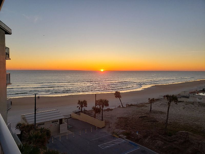 Breathtaking View of the Sun Peeking Up to the Ocean Horizon from our balcony.