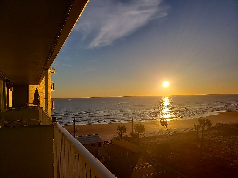 Sipping a cup of coffee on our balcony watching morning sunrise and the beaches.