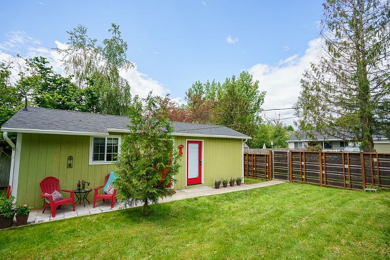 As you can see here, this little bungalow is tucked away behind a privacy fence.