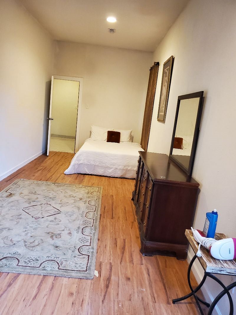 COZY SPACIOUS ROOM 7 FEATURING AKING SIZE BED WITH 42" SMART TV. FRONT VIEW.