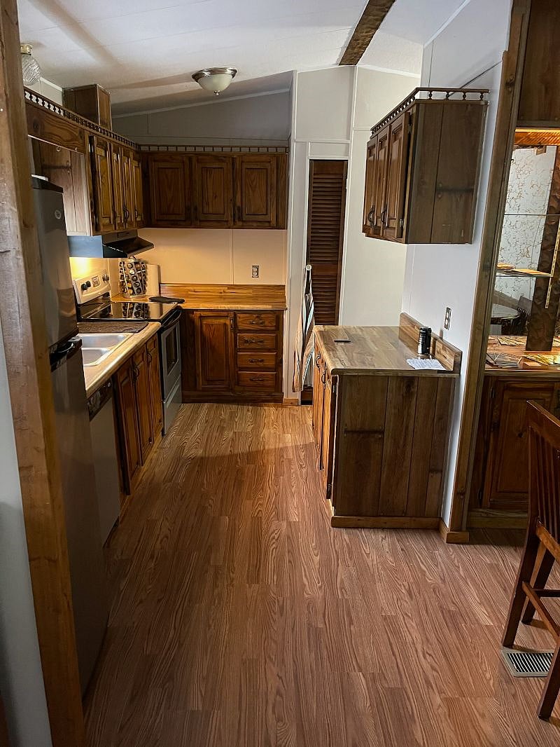 Kitchen has full size fridge, dishwasher, stove, washer & Dryer.