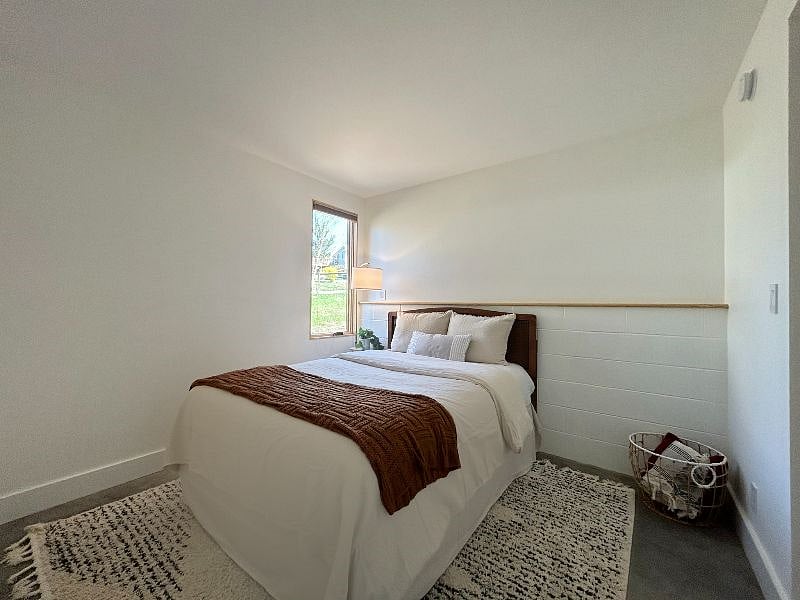 Queen size bed. Window to private backyard.