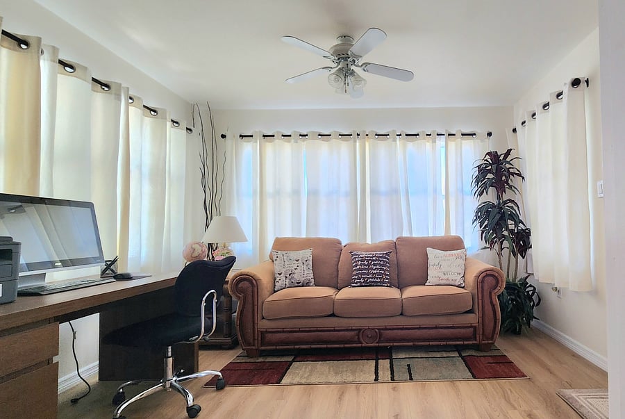 Work, relax, and recharge. sun room with a cozy sofa bed.  