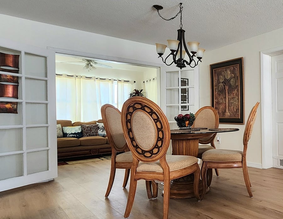 Cozy meets chic in our 4-seater space, featuring a stunning glass round table perfect for intimate gatherings.