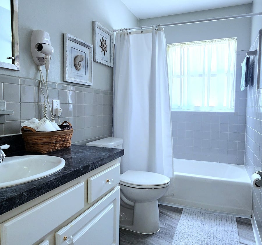 Bathroom #1 features a cozy and inviting space complete with a bathtub, perfect for relaxing soaks.