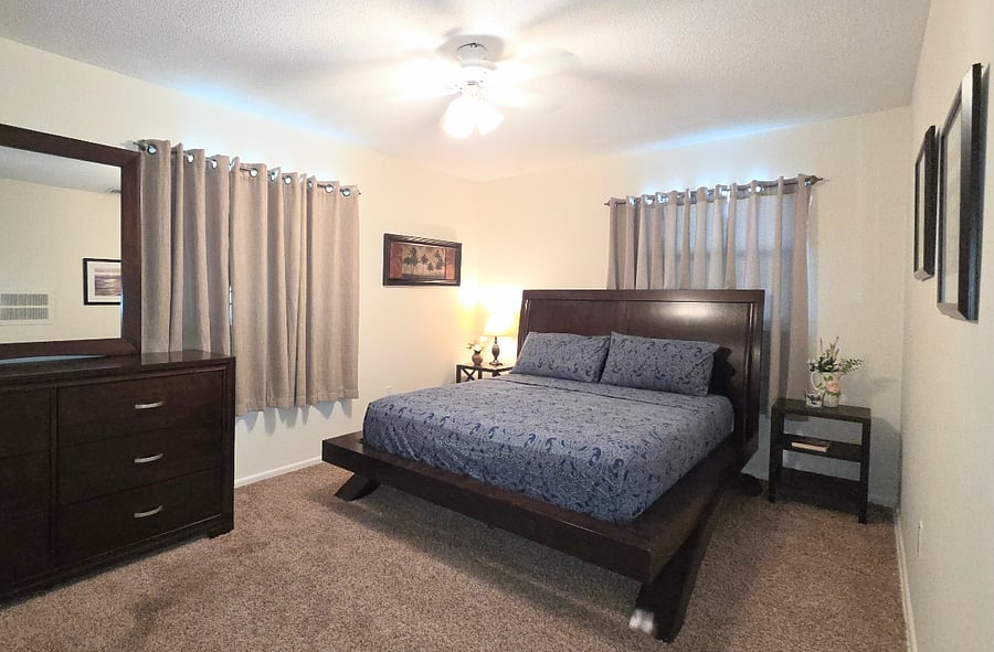 Bedroom #2 features a cozy queen size bed, ensuring a comfortable and restful sleep in a well-appointed space.