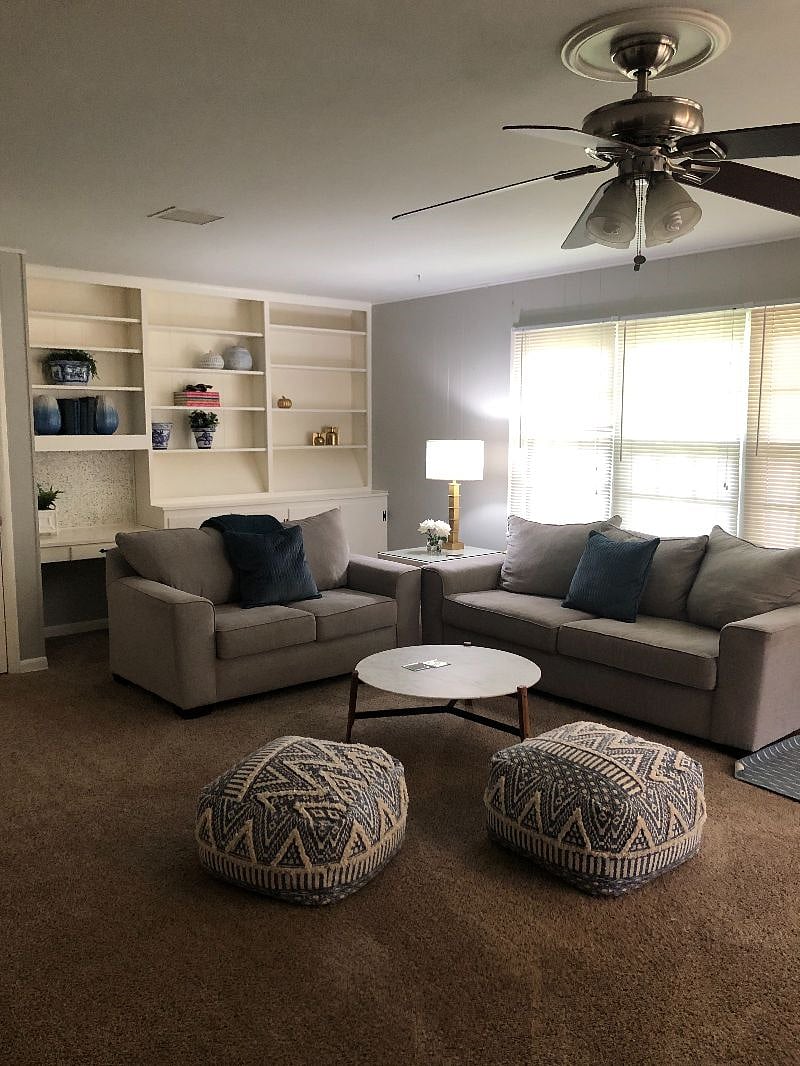 Built in book shelves for storage in family room.