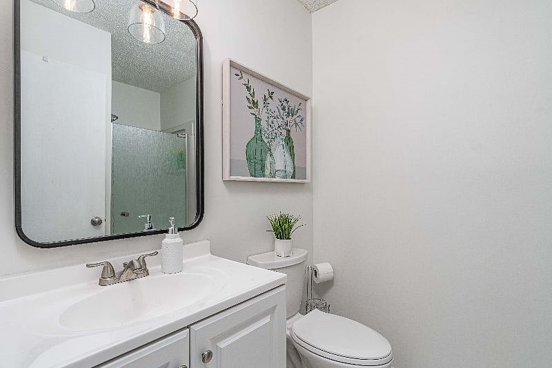 Both bathrooms have cleaning supplies, as well as extra paper products