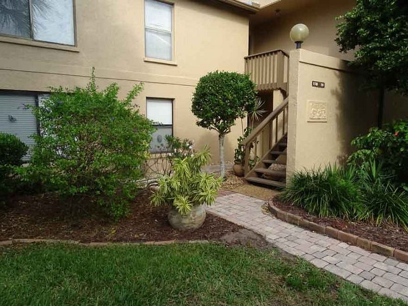 1st floor end unit entrance. View from your parking space. There's a motion sensor light at the entryway.