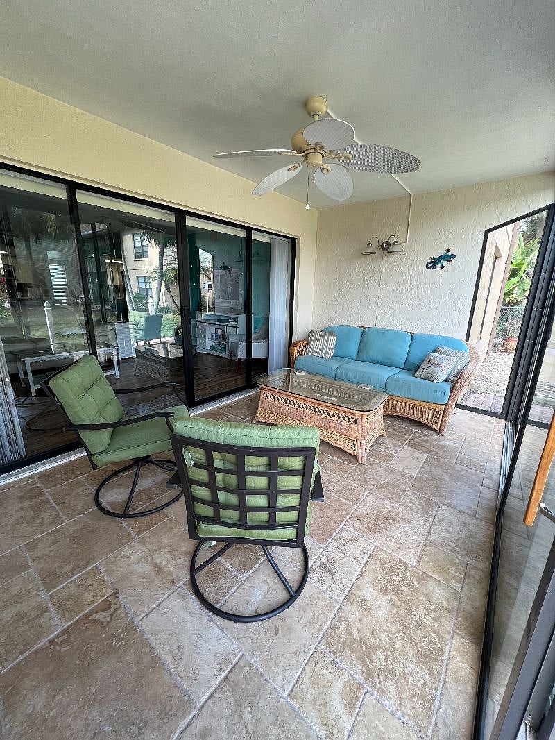 You can relax on this spacious lanai. Sliders to patio have screens for fresh air.  Or open sliders into the living area for great open living space.