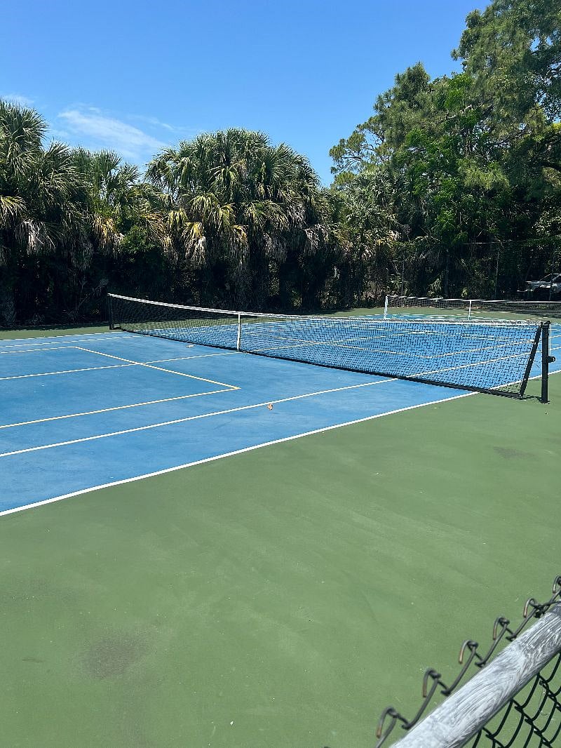 Play tennis or there are two marked pickleball courts with movable nets. There are paddles you can use in the lanai closet.  