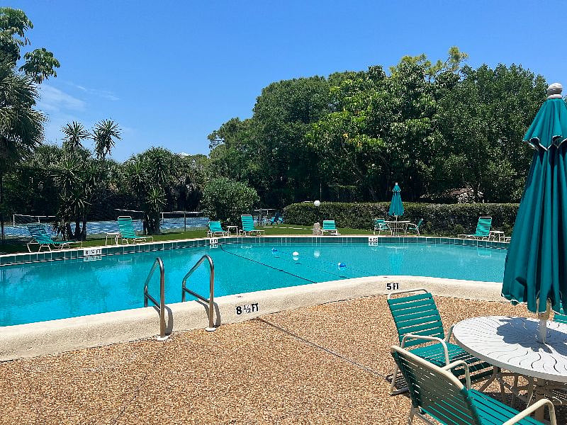 Across the pool from the clubhouse, you access the tennis/pickleball court. 