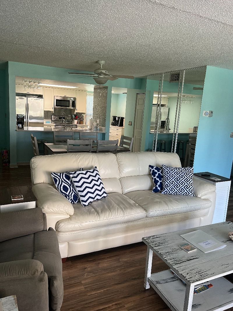 View from living room to dining table, extra seating at the bar into the kitchen.  Lots of light and a great open feel.  
