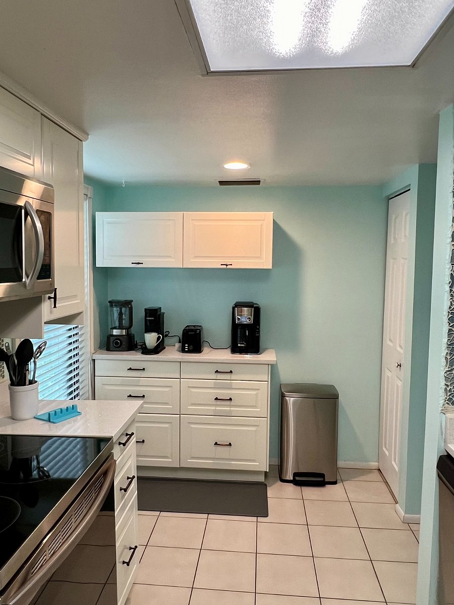 Kitchen pantry, cabinets and coffee/drink bar for your comfort. 