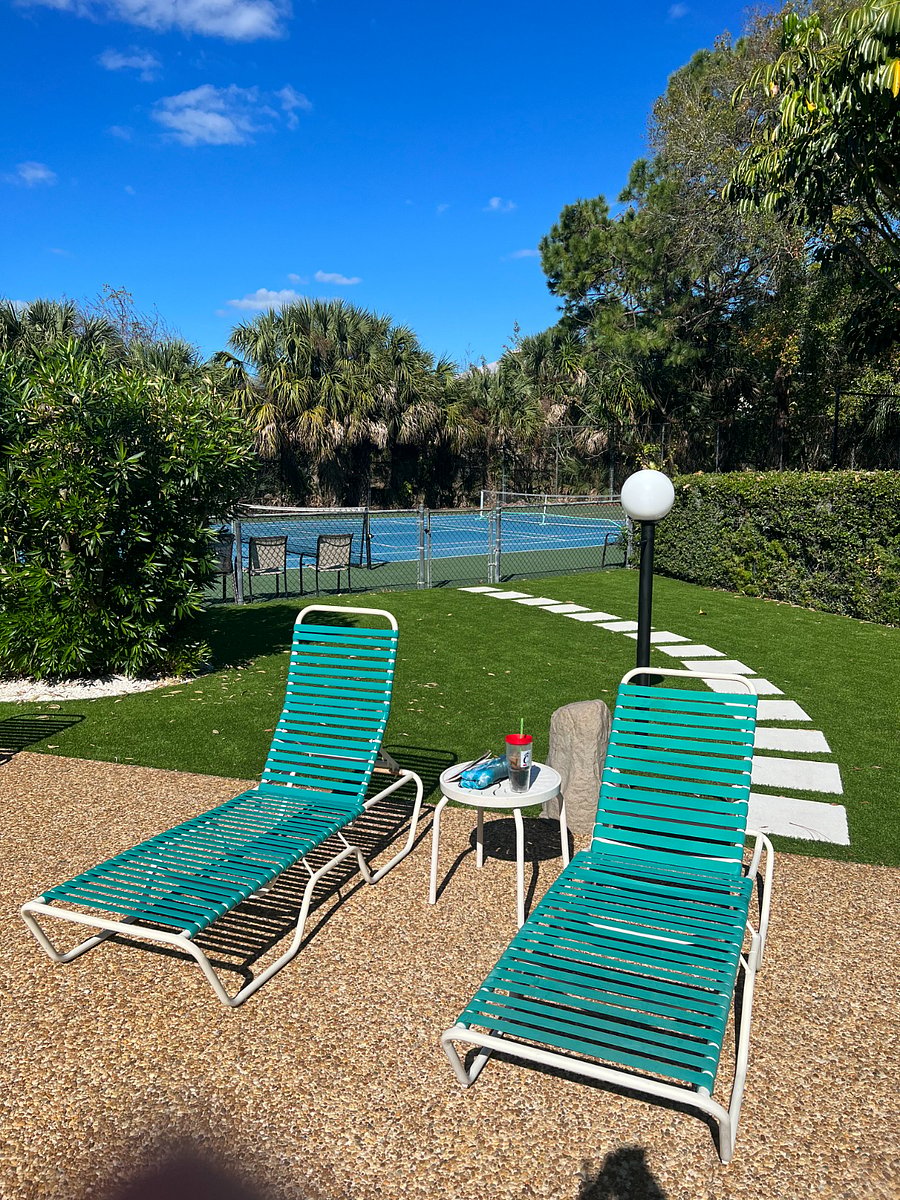 Comfy pool furniture and short walk to the courts.  