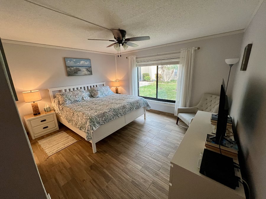 Main bedroom has a King Bed where you can wake to a view of the lake. 