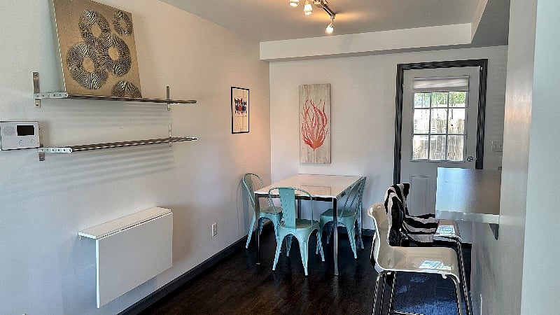 Dining area and island with barstools