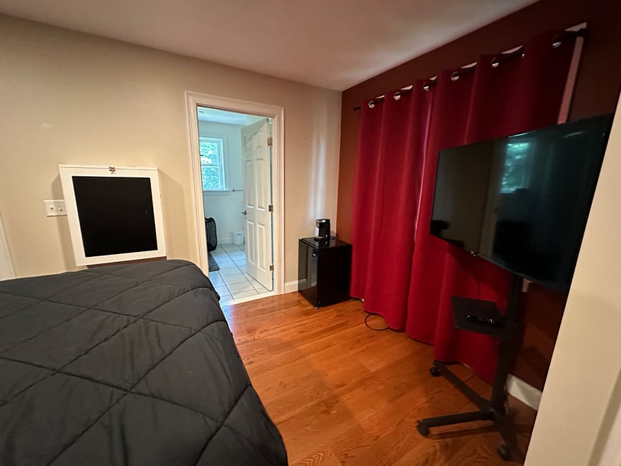 Small refrigerator, single-serve, keurig-style coffee maker and smart TV provided.