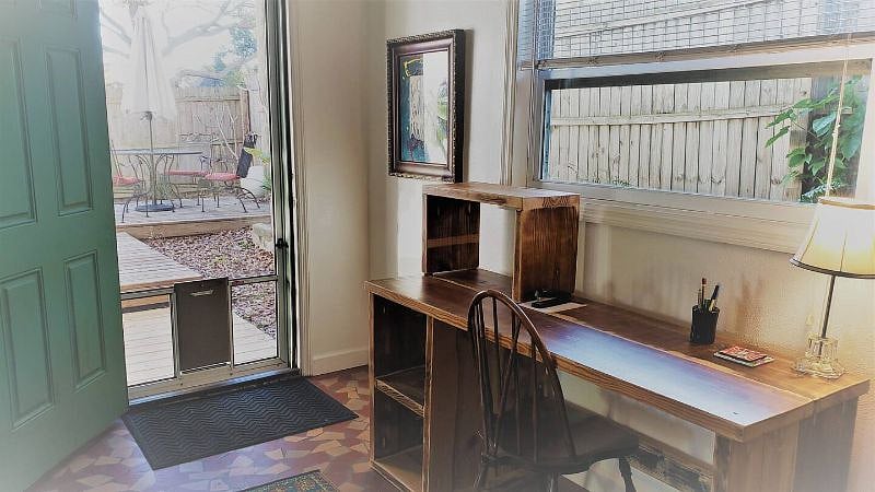 Bright dedicated work space with large desk, standing or seated desk options.