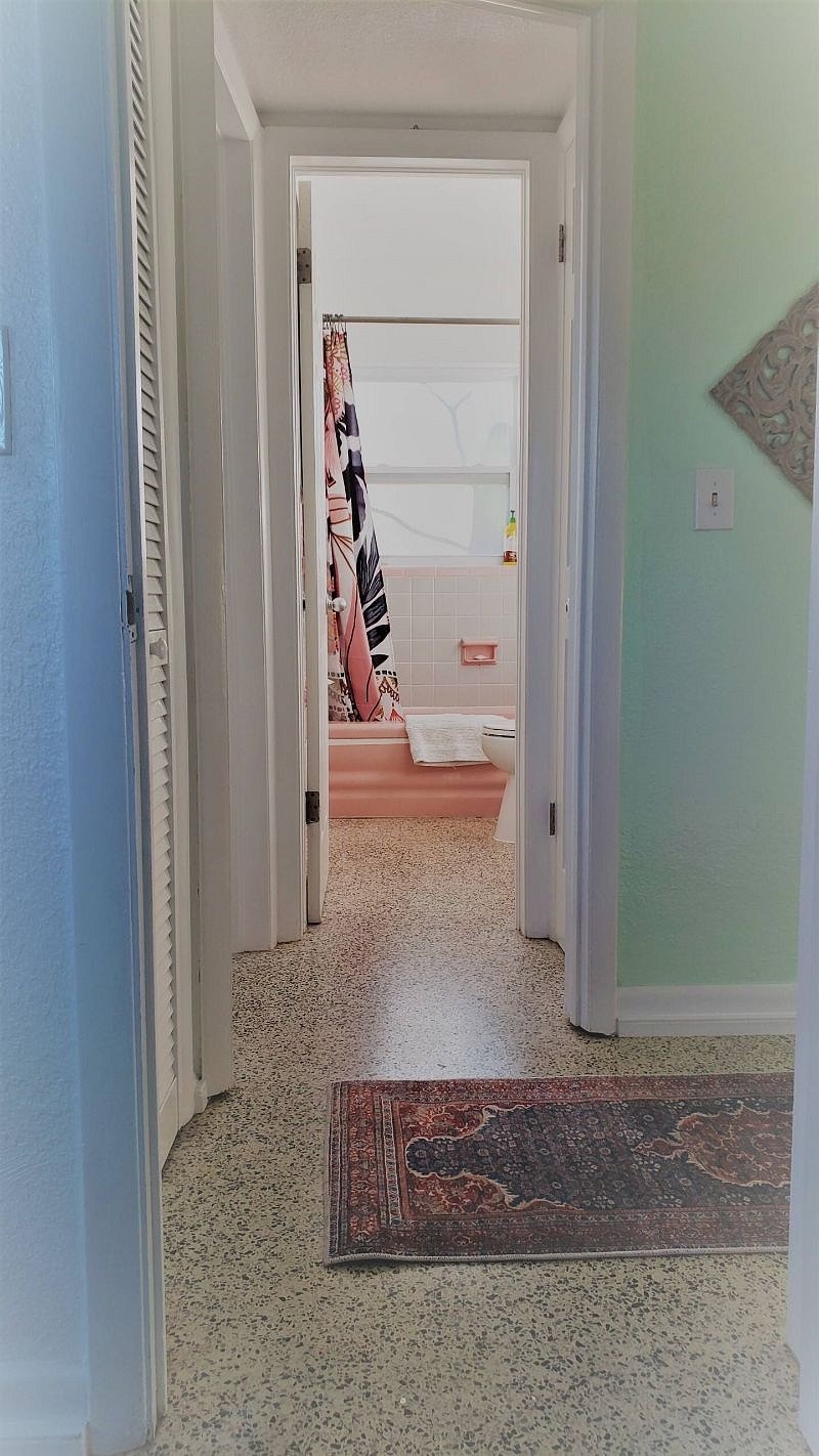 Full bathroom with original tilework