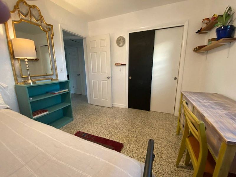 Comfortable double bedroom with dedicated workspace.