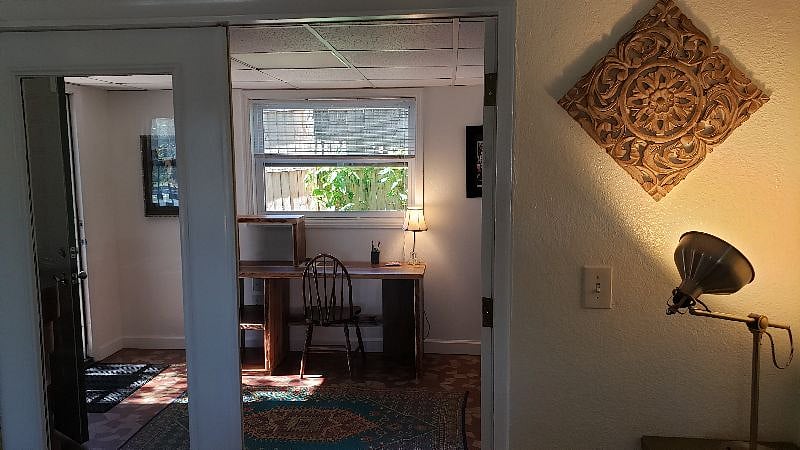 Bright dedicated work space with large desk, standing or seated desk options.