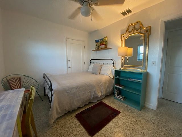 Comfortable double bedroom with dedicated workspace.