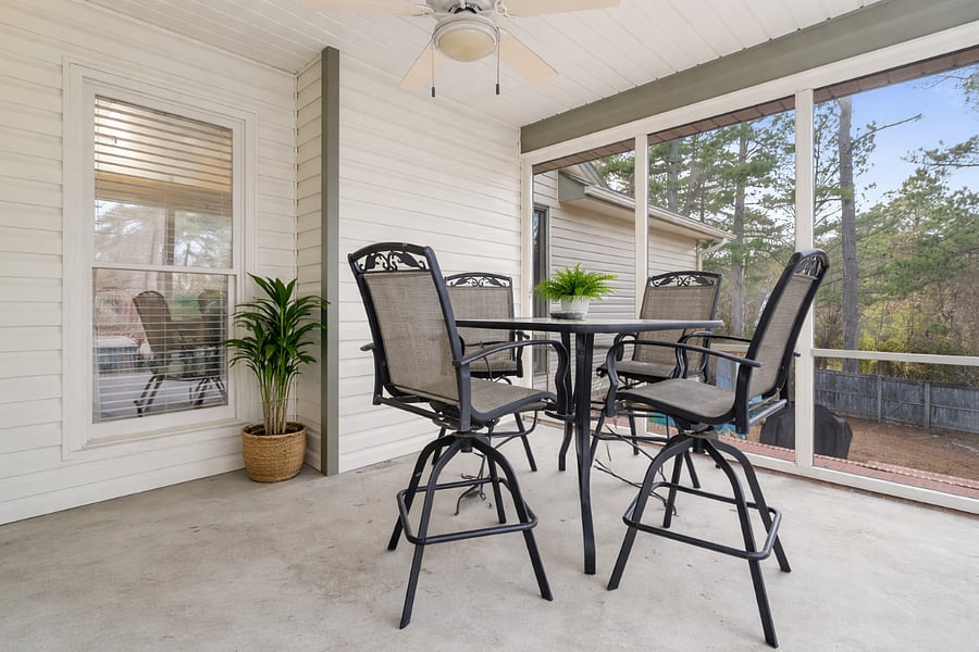 Bright enclosed porchperfect for morning coffee, quiet reading, or relaxing in a comfortable, private space.