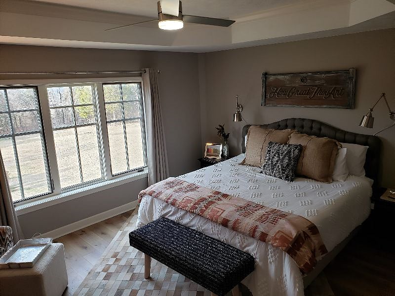 Primary Bedroom with King Lucid mattress and room darkening shades.