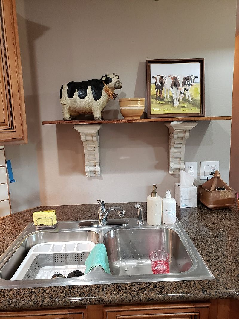 Moooo.....if you don't care for cows in your kitchen, not to worry, a crate  is provided to store decor which is not to your liking!  