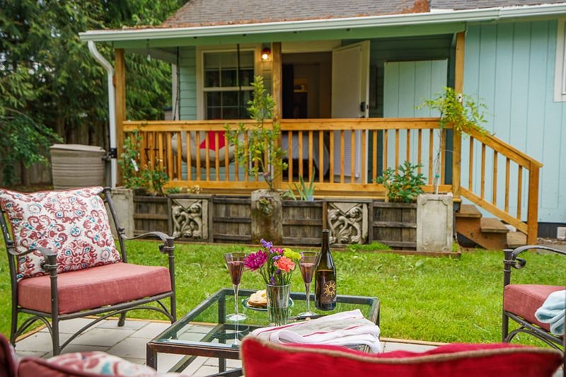 View of the covered back porch and the outdoor sitting area