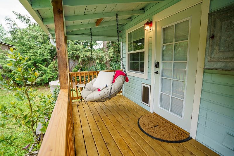 Outdoor back porch. This door goes into the bedroom.