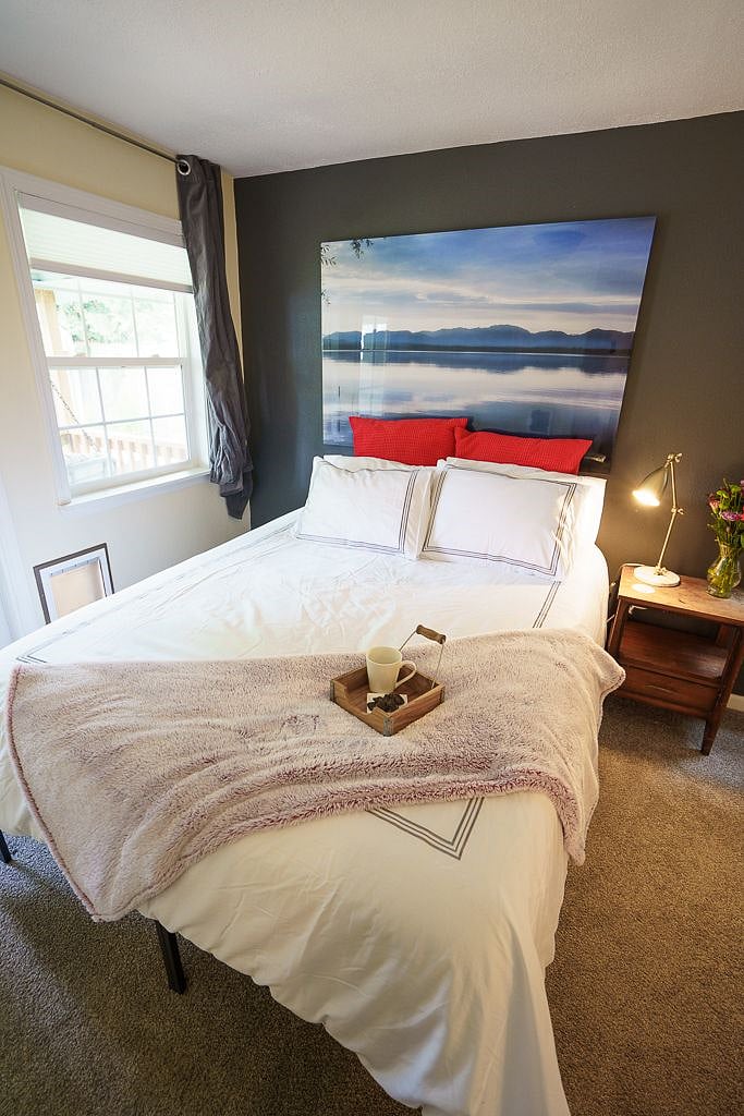Brand new queen size memory foam bed in bedroom.