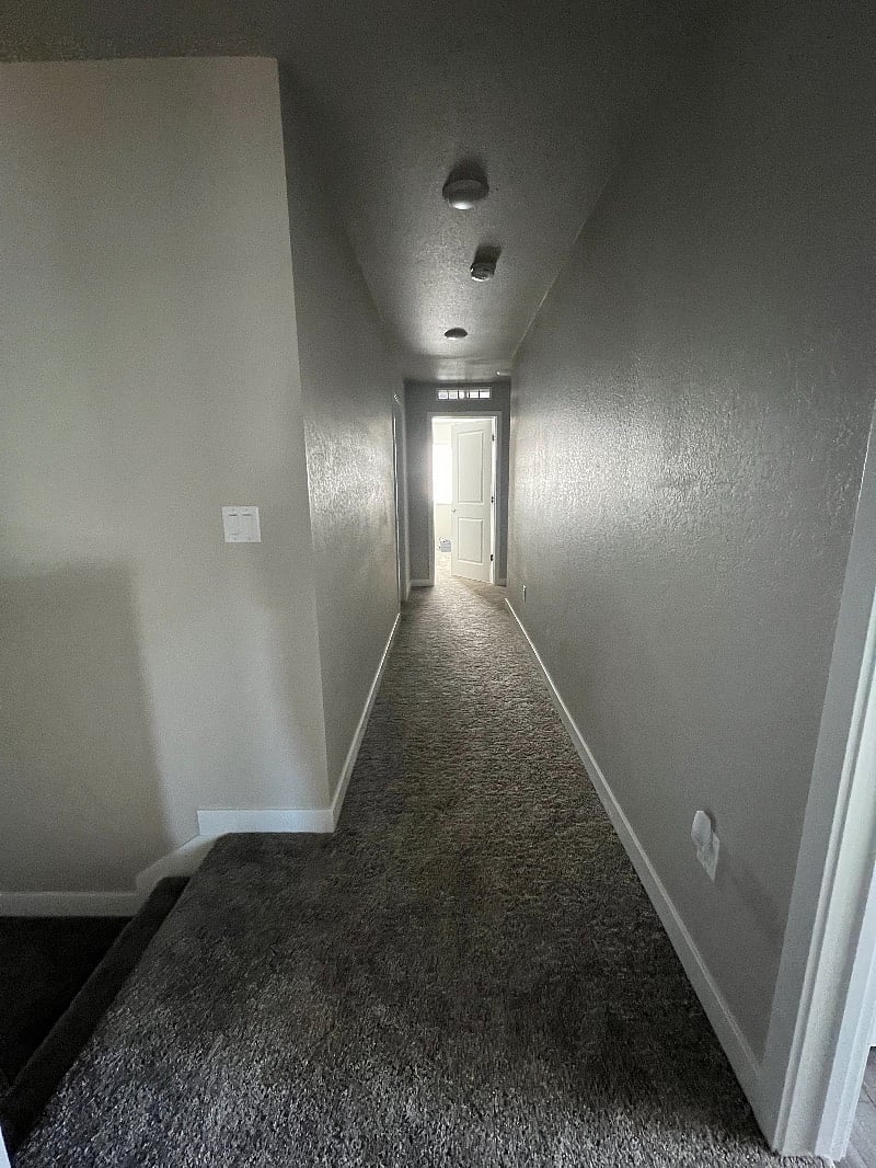 Hallway to laundry room and downstairs 