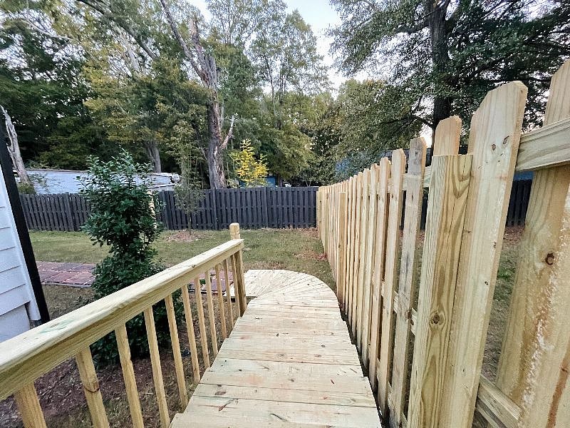 Entrance to the basement apartment. There are a few steps and a ramp after entering through the gate.