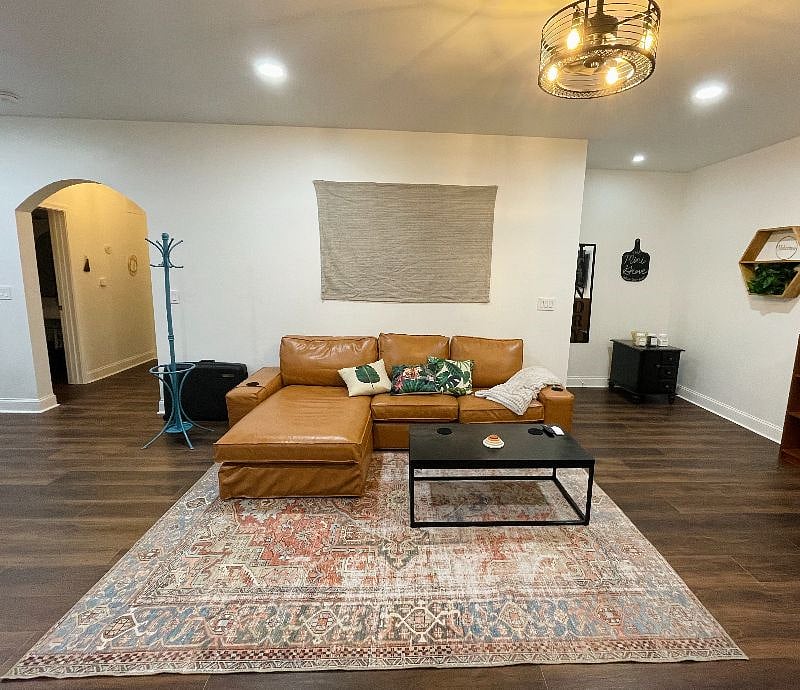 Couch, coffee table and coatrack.