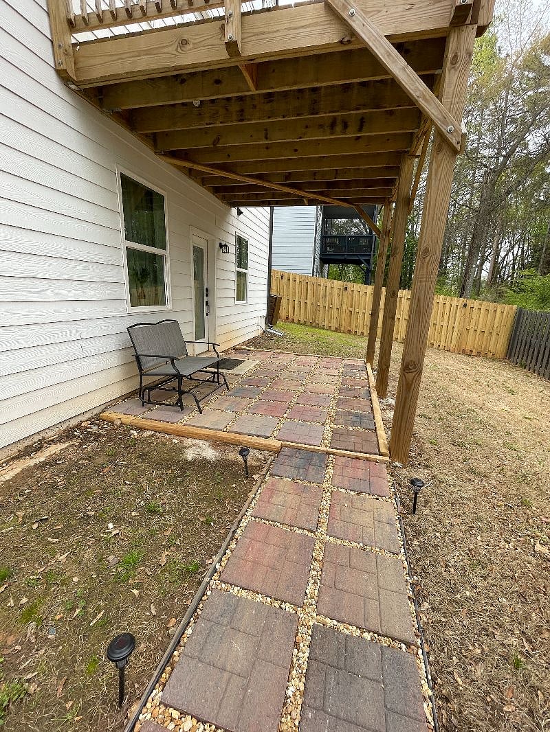 Covered patio with a glider. Table coming soon!Smart 