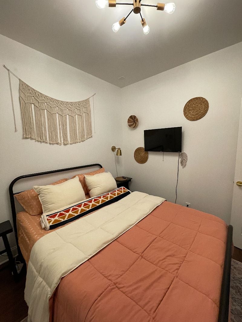 Another view of the bed and TV.