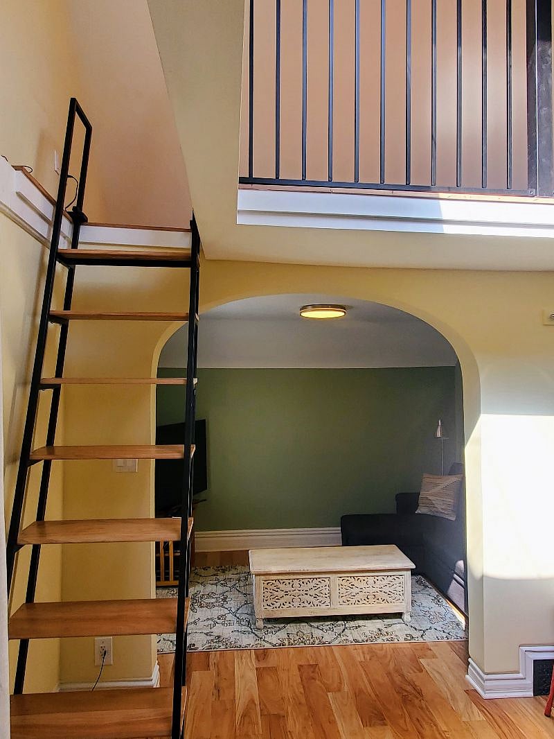 Living room with loft above