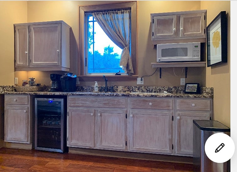 Fully-stocked kitchenette.