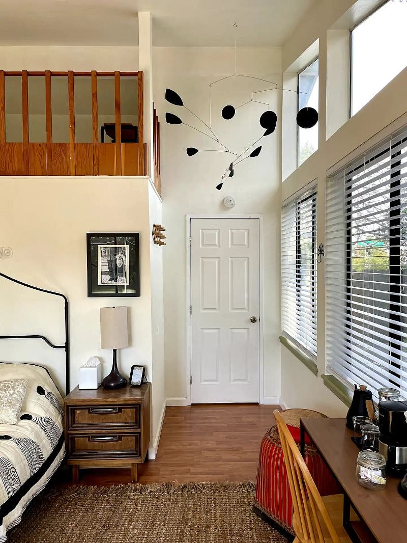 Inside view of your bedroom door and a landing area to hang coats under the giant ceiling mobile.